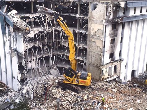 mini excavator demolition multi-story building|rooftop excavators demolished.